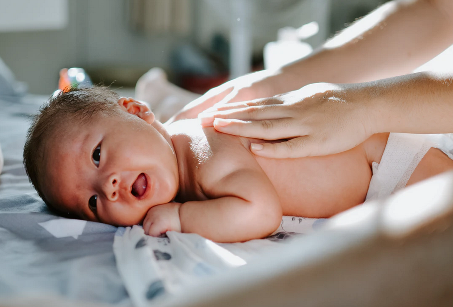 baby being massaged